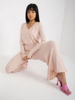 Light pink knitted trousers with wide legs