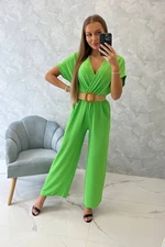 Jumpsuit with decorative belt at the waist light green