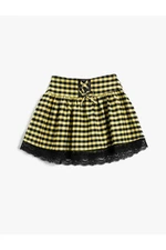 Koton mini sukňa s mašľou a čipkovaným detailom, elastický pás.
