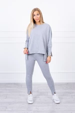 Complete with oversize grey blouse