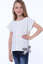 Girls' blouse with patterns and bow