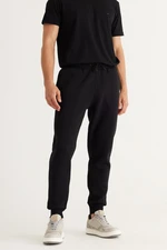 AC&Co / Altınyıldız Classics Men's Black Standard Fit Regular Cut 3 Thread Yarn Inner Fleece Cotton Comfortable Sweatpants.