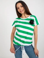 White and green women's striped blouse with a flower