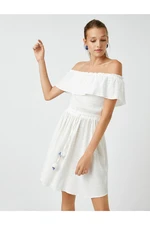 Koton Off-the-Shoulder Mini Dress with Tassel Detail.