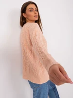 Peach women's sweater with cables