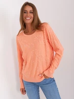 Classic peach sweater with patterns