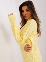 Light yellow loose turtleneck with cables