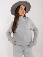 Grey loose turtleneck sweater with patterns