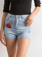 Blue high-waisted shorts with patches