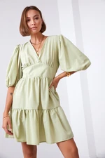 Waist dress with puffed sleeves in olive green