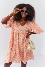 Loose dress with puff sleeves in light orange