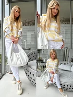 White and yellow striped hooded sweater By o la la