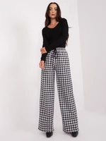 Black and white patterned fabric trousers