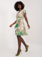 Green-beige women's dress with ruffles