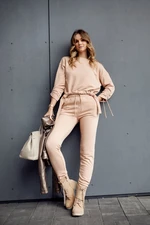 Ordinary women's tracksuit with asymmetrical beige sweatshirt