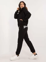 Black three-piece tracksuit