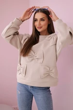 Insulated sweatshirt with beige decorative bows