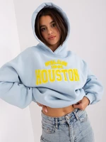 Light blue women's sweatshirt with a slogan