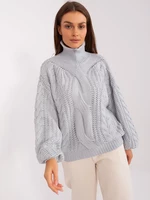 Grey women's oversize sweater with turtleneck