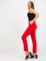 Trousers made of red fabric with belt