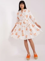 White and orange patterned dress with ruffle