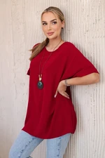 Oversized blouse with burgundy pendant