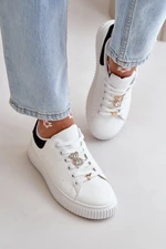 Low sneakers made of eco-leather with badges - white and black Cillione