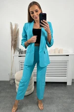 Elegant set of turquoise jacket and trousers