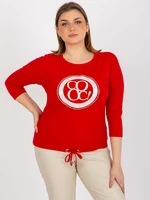 Red oversized blouse with appliqué and hem