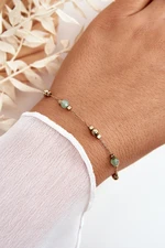 Classic bracelet with green gold beads