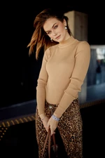 Lady's fitted turtleneck in beige color