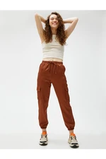 Koton Cargo Pants with a Tie Waist, Pocket Detailed and Elastic Legs.