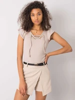 Beige blouse with laced neckline