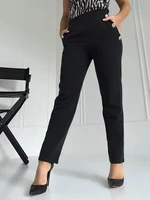 Black trousers decorated with gold Coomore buttons