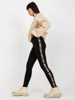 Black casual leggings with inscriptions on the sides