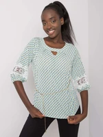 Lady's blouse with a pattern in white and green