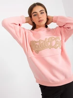 Light pink hoodie with patches