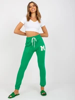 Women's green sweatpants slim fit cut