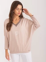 Beige women's oversize blouse with neckline