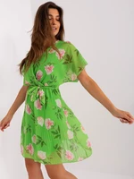 Light green flowing dress with flowers