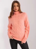 Women's peach turtleneck with braids