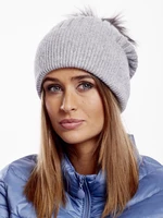 Gray striped hat with fur pompom