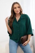 Oversized blouse with button fasteners in dark green color