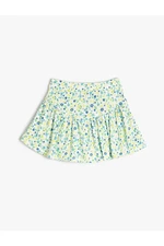 Koton Shorts with a skirt with floral ruffles and an elasticated waist with a ribbed waist.