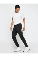 Koton Sports Trousers with Lace-Up Waist Stitching Detail with a Slogan Print.