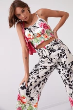Satin ensemble with floral wide trousers and top in light beige and black