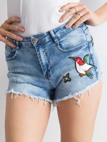 Blue denim shorts with patches