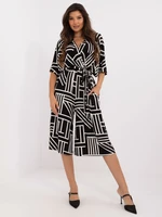 Black patterned jumpsuit with tie on the back