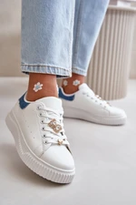 Low sneakers made of eco-leather with white-blue badges Cillione