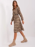 Beige and black flowing dress with print